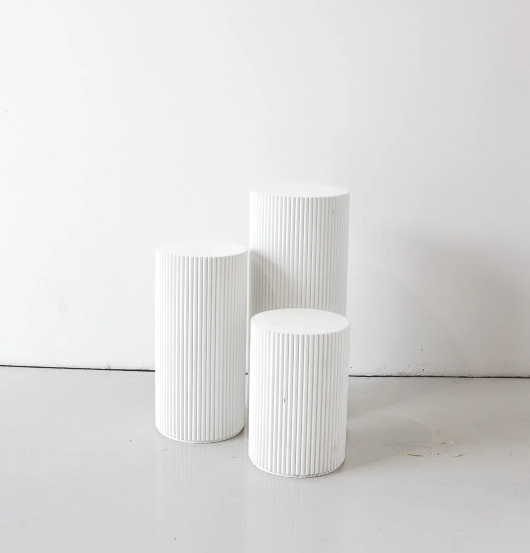 Rippled White Plinths ranging from 24”-36” in height